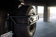 Load image into Gallery viewer, DV8 Offroad 21-23 Ford Bronco Spare Tire Guard &amp; Accessory Mount DV8 Offroad