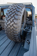 Load image into Gallery viewer, DV8 Offroad 2019+ Jeep Gladiator Universal Stand Up In-Bed Tire Carrier DV8 Offroad