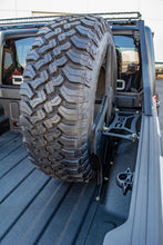 Load image into Gallery viewer, DV8 Offroad 2019+ Jeep Gladiator Universal Stand Up In-Bed Tire Carrier DV8 Offroad