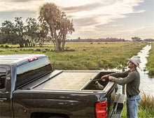 Load image into Gallery viewer, Roll-N-Lock 2020 Chevy Silverado / GMC Sierra 2500-3500 80-1/2in M-Series Retractable Tonneau Cover Roll-N-Lock