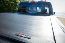 Load image into Gallery viewer, Roll-N-Lock 2020 Chevy Silverado / GMC Sierra 2500-3500 77-3/8in E-Series Retractable Tonneau Cover Roll-N-Lock