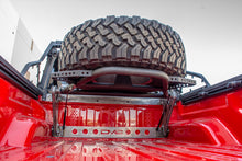 Load image into Gallery viewer, DV8 Offroad 2019+ Jeep Gladiator In-Bed Adjustable Tire Carrier DV8 Offroad