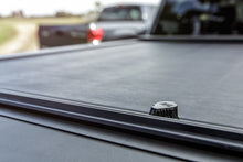 Load image into Gallery viewer, Roll-N-Lock 2020 Chevy Silverado / GMC Sierra 2500-3500 80-1/2in M-Series Retractable Tonneau Cover Roll-N-Lock